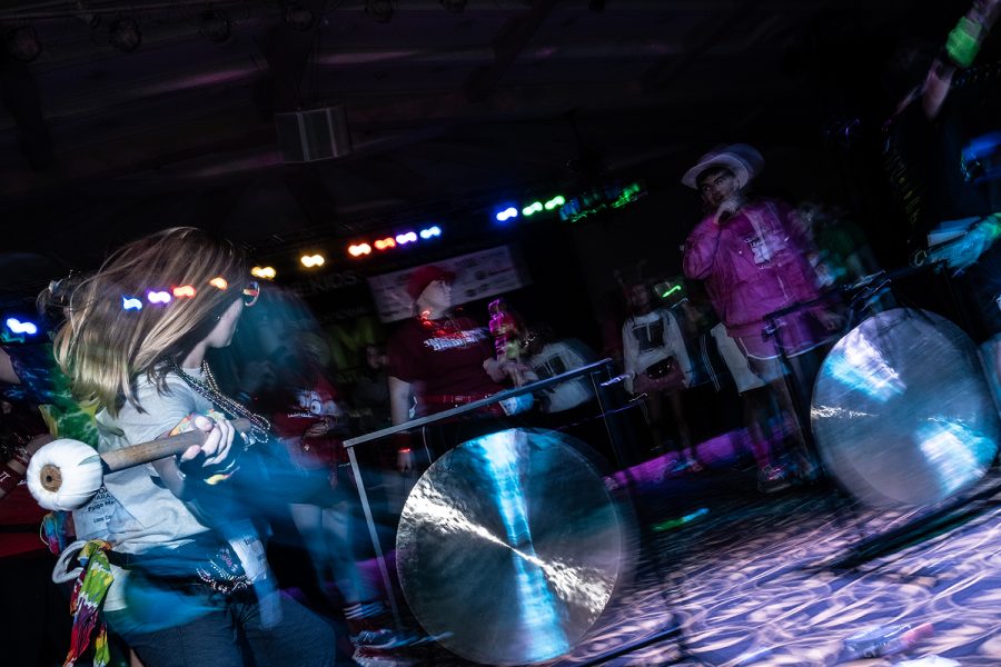 Dancers hit a gong during Dance Marathon 26 at the IMU on Saturday, February 8, 2020.