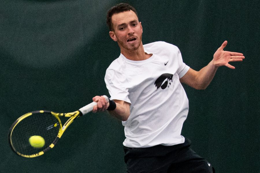 Iowas Kareem Allaf hits a forehand during a mens tennis match between Iowa and Nebraska-Omaha at the HTRC on Saturday, Jan. 25, 2020. The Hawkeyes defeated the Mavericks, 6-1. 
