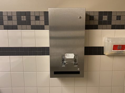 A feminine-hygiene products dispenser is seen in a bathroom in the Adler Journalism Building on Jan. 24, 2020.