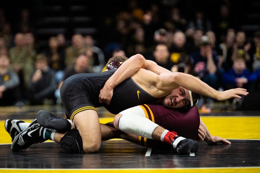 Iowas 174-pound Michael Kemerer wrestles Minnesotas Devin Skatzka during a wrestling dual meet between No. 1 Iowa and No. 13 Minnesota at Carver-Hawkeye Arena on Saturday, Feb. 15, 2020.The Hawkeyes defeated the Gophers, 35-6.