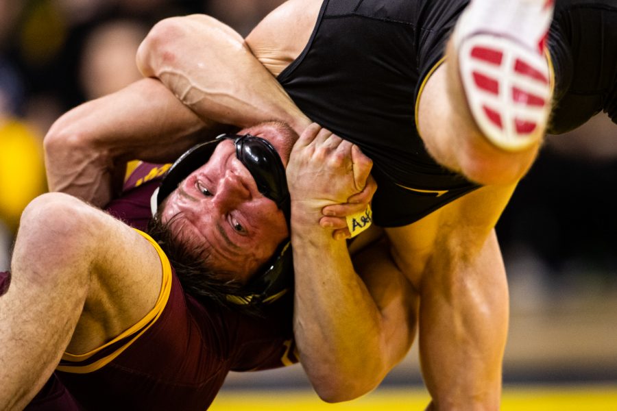 Iowas+141-pound+Max+Murin+wrestles+Minnesotas+Mitch+McKee+during+a+wrestling+dual+meet+between+No.+1+Iowa+and+No.+13+Minnesota+at+Carver-Hawkeye+Arena+on+Saturday%2C+Feb.+15%2C+2020.The+Hawkeyes+defeated+the+Gophers%2C+35-6.