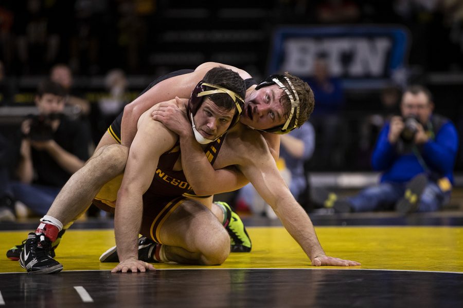 IowaÕs 197-pound Jacob Warner wrestles MinnesotaÕs Hunter Ritter during a wrestling dual meet between No. 1 Iowa and No. 13 Minnesota at Carver-Hawkeye Arena on Saturday, Feb. 15, 2020. No. 6 Warner defeated Ritter by major decision, 12-4, and the Hawkeyes defeated the Gophers, 35-6.