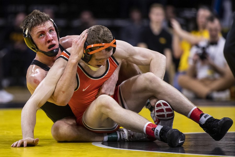 IowaÕs 141-pound Max Murin grapples with Oklahoma StateÕs Dusty Hone during a wrestling dual meet between No 1. Iowa and No. 9 Oklahoma State at Carver-Hawkeye Arena on Sunday, Feb. 23, 2020.  No. 5 Murin defeated No. 12 Hone by major decision, 15-4, and the Hawkeyes defeated the Cowboys, 34-6.