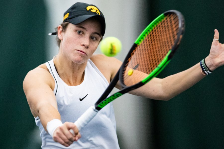 Iowas Elise Van Heuvelen hits a backhand during a womens tennis match between Iowa and Colorado at the HTRC on Sunday, Feb. 16, 2020. The Buffaloes defeated the Hawkeyes, 4-3.