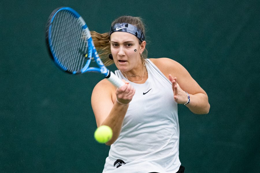 Iowas Ashleigh Jacobs hits a forehand during a womens tennis match between Iowa and Colorado at the HTRC on Sunday, Feb. 16, 2020. The Buffaloes defeated the Hawkeyes, 4-3.