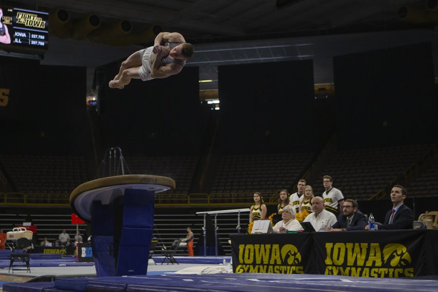 Iowa’s all-around Carter Tope performs on the vault during a men’s gymnastics meet between Iowa and Illinois at Carver Hawkeye Arena on March 1, 2020. The Hawkeyes tied with the Fighting Illini with a score of 403.050. Tope earned a score of 14.150. 