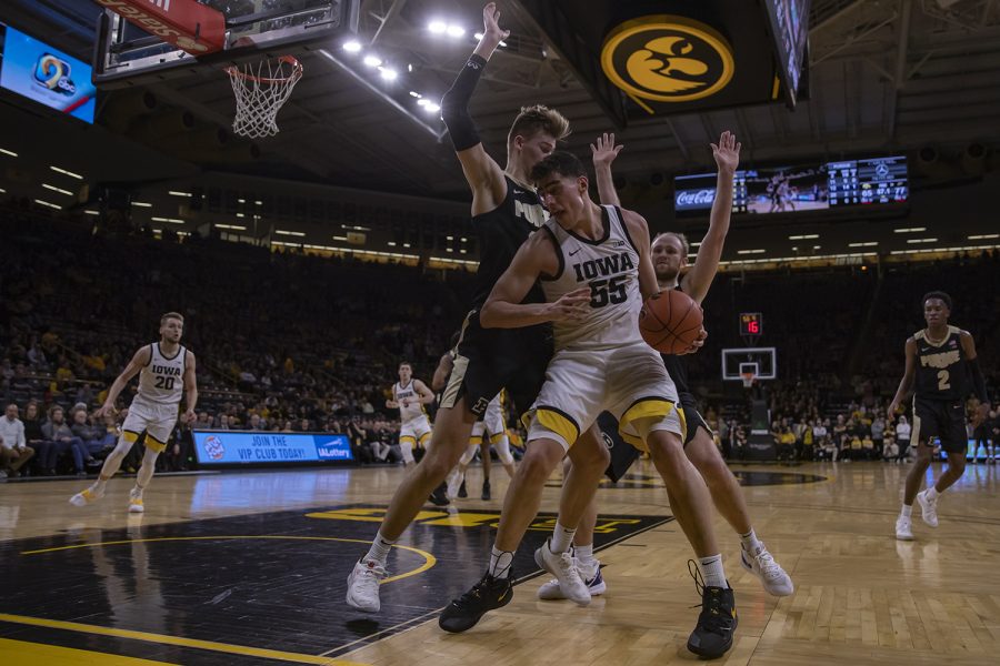 Iowa center Luka Garza shields the ball during a mens basketball game between Iowa and Purdue at Carver Hawkeye Arena on Tuesday, March 3, 2020. The Hawkeyes were defeated by the Boilermakers, 77-68. 