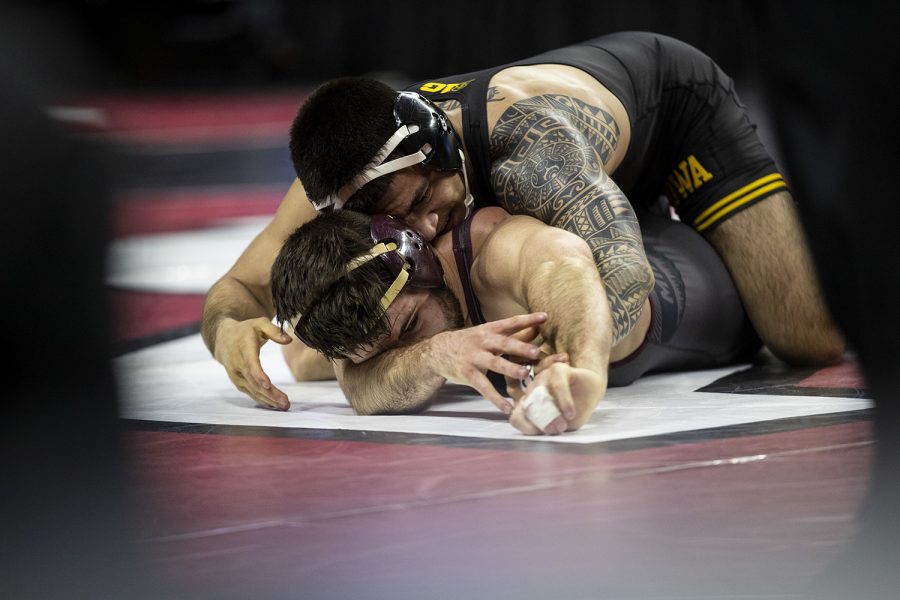 Iowas 149-pound Pat Lugo grapples with Minnesotas Brayton Lee during session two of the Big Ten Wrestling Tournament in Piscataway, NJ on Saturday, March 7, 2020. Lugo won by major decision, 11-3. 