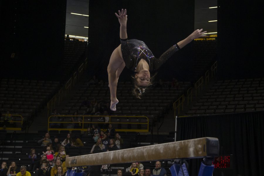 Iowa’s all-around Mackenzie Vance performs on the beam during a women’s gymnastics meet between Iowa and West Virginia on Sunday, March 8, 2020 at The Carver Hawkeye Arena. The Hawkeyes defeated the Mountaineers 196.750-196.175. Vance earned a score of 9.700. 