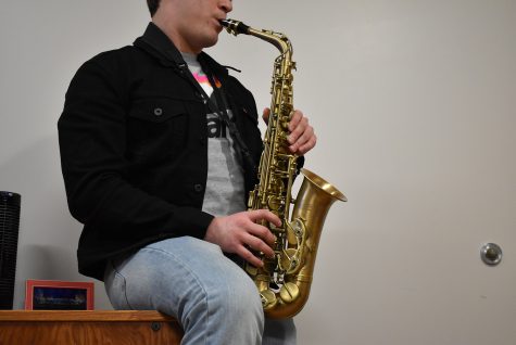 Easa Aristizabal plays George Micheals “Careless Whisper” on his saxophone  on Monday, Feb. 24, 2020. 