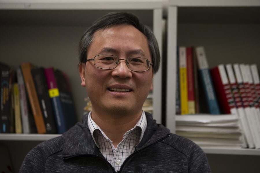 Xiaodong Wu poses for a portrait in his office located in the Seamans Center on Friday, Feb. 28, 2020.