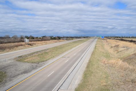 A section of U.S. Highway 218 leading to Iowa City is seen empty in Mount Pleasant, Iowa on Sunday. Social distancing has reduced travel around the country in response to the COVID-19 pandemic. 
