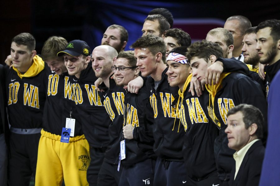 Members of the Iowa wrestling team pose for a photo after winning the team title during the final session of the Big Ten Wrestling Tournament in Piscataway, NJ, on Sunday, March 8, 2020. Iowa won the team title with 157.5 points. 