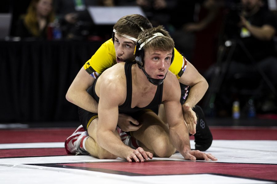 Iowas 141-pound Max Murin grapples with Marylands  Hunter Baxter during session one of the Big Ten Wrestling Tournament in Piscataway, NJ on Saturday, March 7, 2020. Murin won by fall in 5:57. (Nichole Harris/The Daily Iowan)