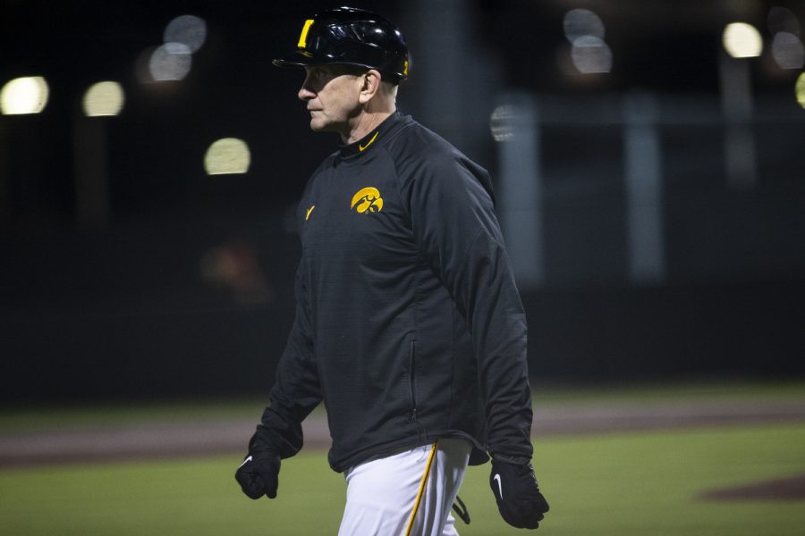 Iowa head coach Rick Heller watches the game from third base during a baseball game between Iowa and Grand View on March 3, 2020. The Hawkeyes defeated the Vikings 15-2. (Nichole Harris/The Daily Iowan)