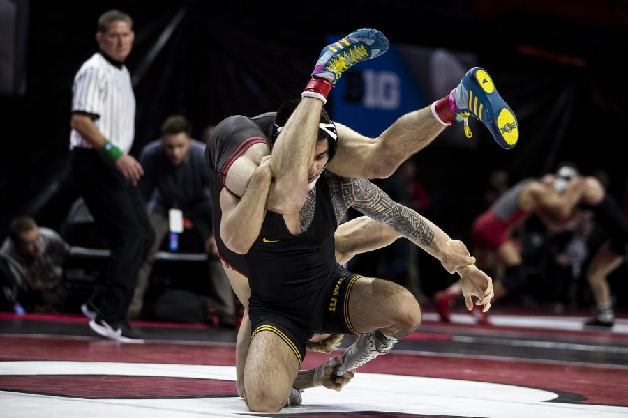 Iowas 149-pound Pat Lugo grapples with Nebraskas Collin Purinton during session one of the Big Ten Wrestling Tournament in Piscataway, NJ on Saturday, March 7, 2020. Lugo won by major decision, 11-3. (Nichole Harris/The Daily Iowan)