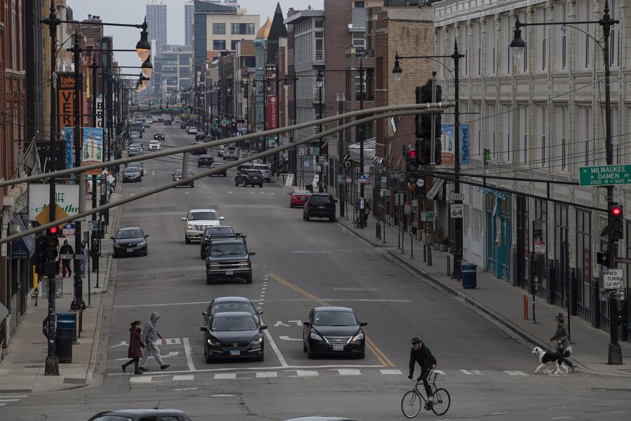 North Ave/IL Route 64 is seen just off of the “Six Corners” intersection of Milwaukee, Damen, and North Avenues on Tuesday, March 24 at 1:30 p.m. near the center of the Wicker Park neighborhood in Chicago, IL. This area is known for its bustling streets lined with a multitude of shops and restaurants. Illinois Governor J.B. Pritzker declared a shelter-in-place directive for the state three days prior, limiting the amount of people out in public in an effort to prevent the spread of COVID-19. The Wicker Park neighborhood has seen decreased activity as a result, and residents of the city face the effects of COVID-19 and the risks of normalcy.