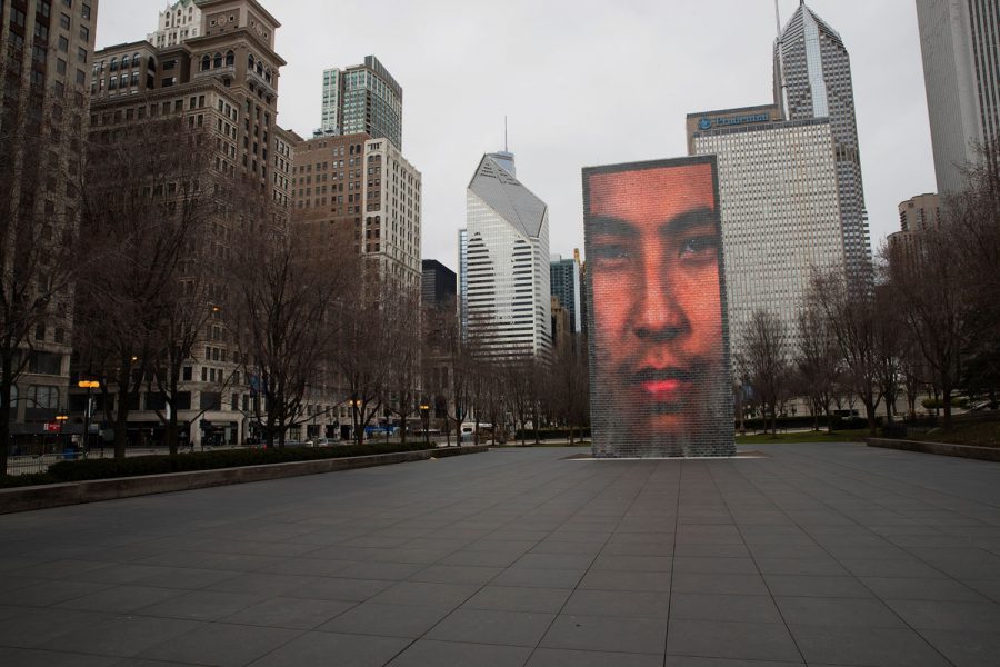 One of Crown Fountain’s two large video sculptures portrays a face in an empty plaza in the afternoon of Saturday, March 21, hours before the implementation of Gov. Pritzker’s shelter-in-place order. On the west side of Millennium park and next to Michigan Avenue, this plaza doubles as a reflecting pool and is teeming with tourists and families during peak visiting hours in the summer. At the beginning of the Spring season and during the COVID-19 outbreak, the plaza sees almost no visitors.