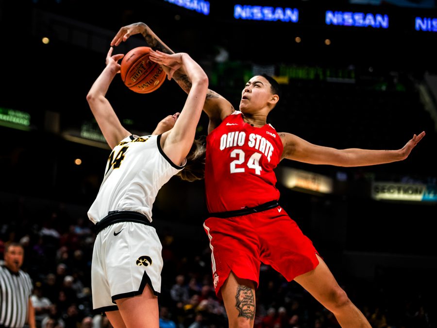 Ohio State guard Kierstan Bell blocks a shot from Iowa guard McKenna Warnock during the Iowa vs. Ohio State Womens Big Ten Tournament game at Bankers Life Fieldhouse in Indianapolis on Friday, March 6, 2020. The Buckeyes defeated the Hawkeyes 87-66.