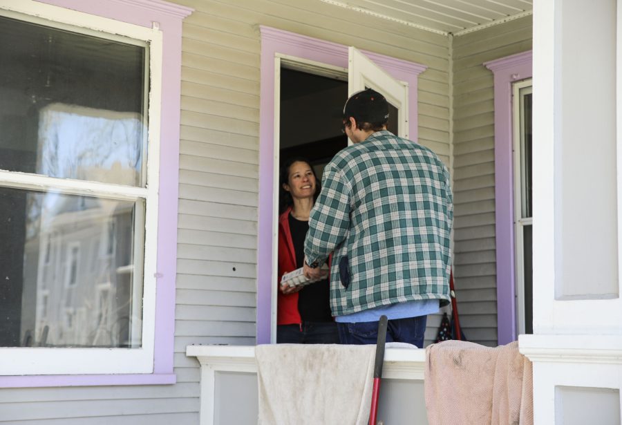 Andrew Kueter-Chadwick makes the 1st stop of the day delivering one dozen eggs to Maurine Neiman as seen.on Saturday April 18,2020.