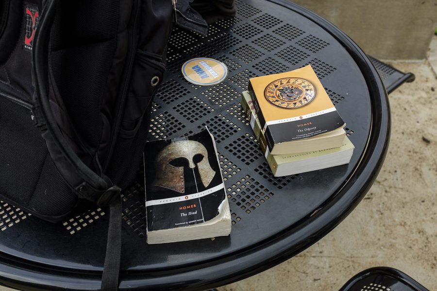 Copies of various works of literature from Homer sit on a table during the Homerathon on the T. Anne Cleary walkway on Wednesday, March 27, 2019. 