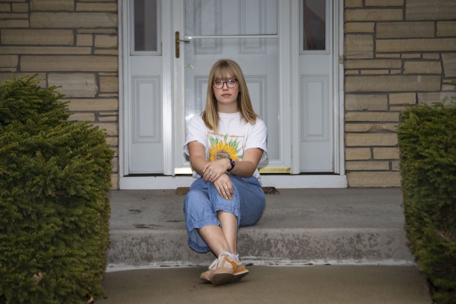 High school senior Alex Marsh poses for a portrait outside her home on Saturday, April 11, 2020. Marsh has not yet decided where she will attend school next fall. 
