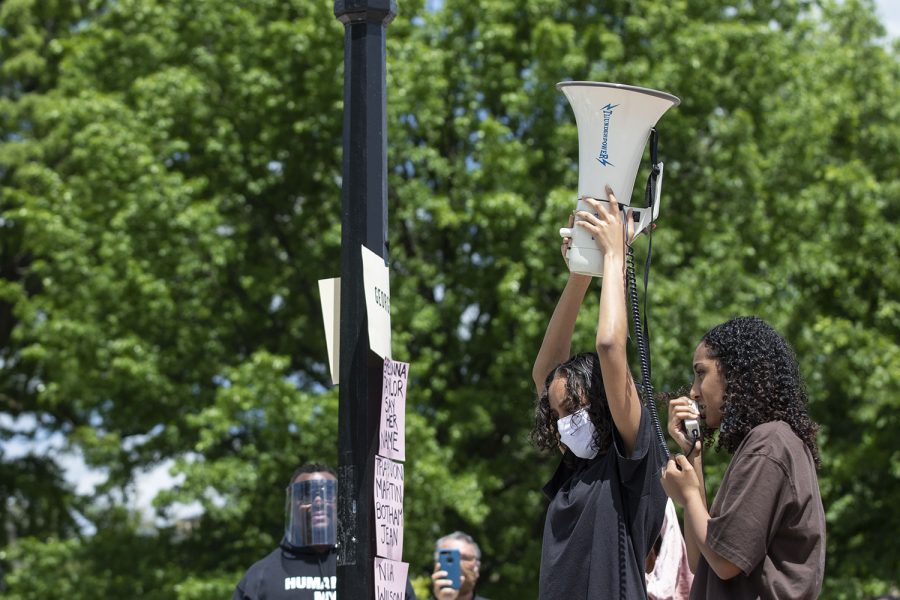 Sisters Raneem Hamad (left) and Lujayn Hamad (right) address the crowd during the Say Their Names rally on the Pentacrest on Saturday, May 30, 2020. Iowa City community members gathered to remember George Floyd, Ahmed Arbury, Yassin Mohamed and others. Money was collected during the event which went in donation to a vehicle procession carrying protesters going to Minneapolis. The Hamad sisters were among the protesters driving to Minneapolis. 