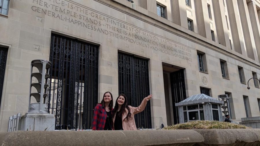 Marissa Payne and Julia Shanahan pose outside the U.S. Justice Department in Washington on March 24, 2019 during the DI Ethics and Politics Initiative teams annual trip to interview Iowas congressional delegation. They thought it was pretty cool to be there around the time special counsel Robert Mueller released his report on the investigation into Russian interference in the 2016 election.