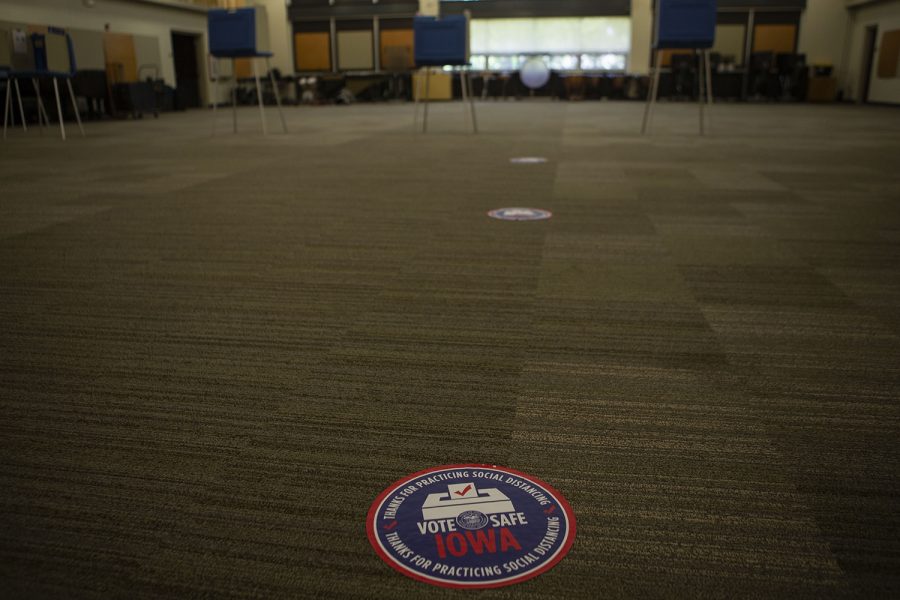 Stickers on the floor encouraging social distancing are seen on the floor on Tuesday, June 2 in Iowa City West High School.