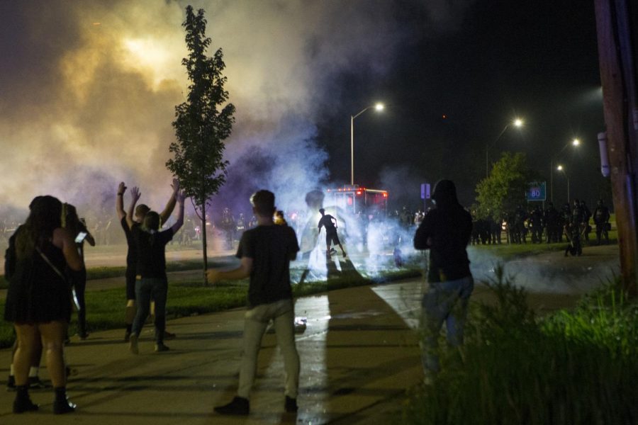 Law Enforcement Officers Use Tear Gas And Flash Bangs On