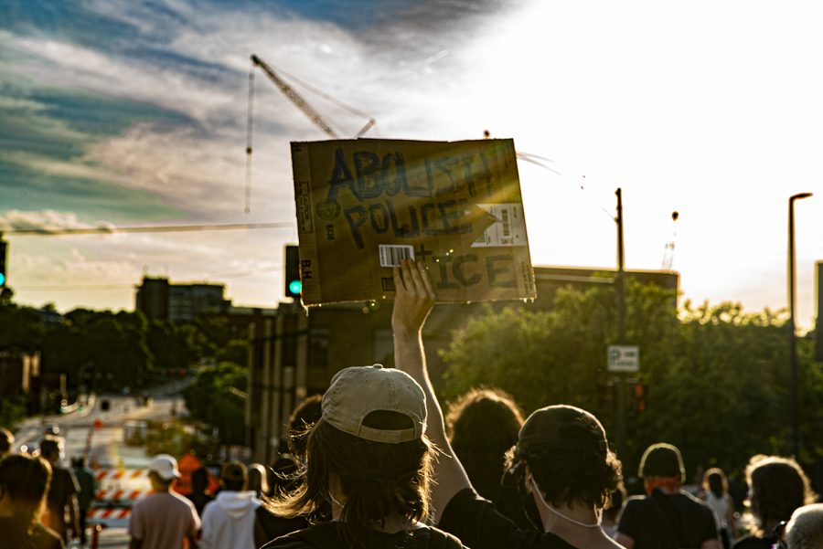 Iowa City citizens march through downtown as part of another protest on Sunday, June 14th, 2020. Iowa City, along with several other major cities across the country has spent the past few weeks protesting the murder of George Floyd at the hands of the police and systemic racism.