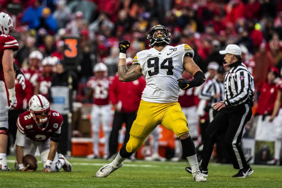Iowa defensive end A.J. Epenesa celebrates tackling Nebraska quarterback Adrian Martinez during the football game against Nebraska at Memorial Stadium on Friday, November 29, 2019. The Hawkeyes defeated the Cornhuskers 27-24. Epenesa had two sacks throughout the game.