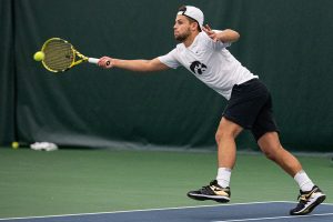 Iowas Will Davies hits a forehand during a mens tennis match between Iowa and Nebraska-Omaha at the HTRC on Saturday, Jan. 25, 2020. The Hawkeyes defeated the Mavericks, 6-1.