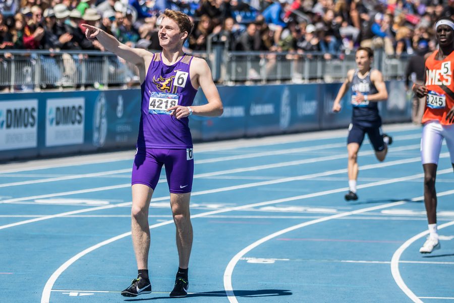 Johnston High School's Joe Schaefer celebrates his win in the boys' 800m race at the 2019 Drake Relays in Des Moines, IA, on Friday, April 26, 2019. (Shivansh Ahuja/The Daily Iowan)