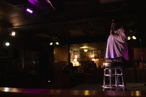 Aloe Mean delivers stand-up during the Comedy Showcase at the Mill on Friday, Nov. 1, 2019. As a part of Witching Hour, comedians joked about the 2020 presidential campaign, rich people, and getting married.