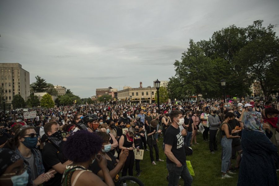 A crowd gathers on the Pentacrest to listen to speeches from organizers and elected officials from the city, county, and state levels prior to a march to support the Black Lives Matter movement and protest police brutality on Saturday, June 6 in Iowa City.