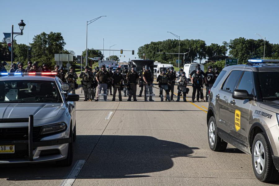Iowa State Troopers stand behind a barricade blocking the I-80 from protesters on Thursday, June 11th, 2020. Iowa City, along with several major cities across the country have spent several weeks protesting racism in the police force and the murder of George Floyd. 