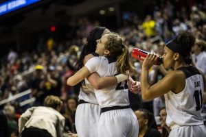 Iowa center Megan Gustafson and guard Kathleen Doyle hug after the win against NC State in the NCAA Sweet 16 game at the Greensboro Coliseum Complex on Saturday, March 30, 2019. The Hawkeyes defeated the Wolfpack 79-61.