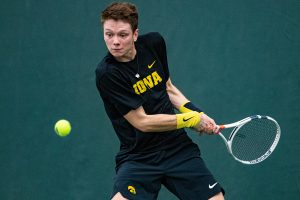 Iowas Jason Kerst hits a backhand during a mens tennis match between Iowa and Texas Tech at the HTRC on Thursday, Jan. 16, 2020. The Red Raiders defeated the Hawkeyes, 4-3.