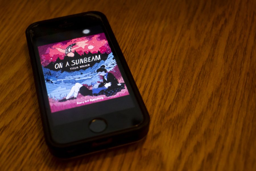Cover art for On A Sunbeam, a graphic novel by Tillie Walden, is seen from a phone screen on Thursday, July 23, 2020. On A Sunbeam is one of many titles included on the reading list for a new LGBTQ+ book club on campus.