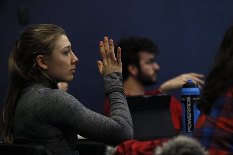 Student-Athlete Constituency Senator Marissa Mueller raises her hand in response to a question given by Dr. Maria Bruno during a UISG meeting at the Iowa Memorial Union on Thursday, February 18, 2020.