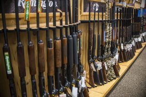 Guns are displayed at Scheels in Coralville on Tuesday, April 11, 2018. 