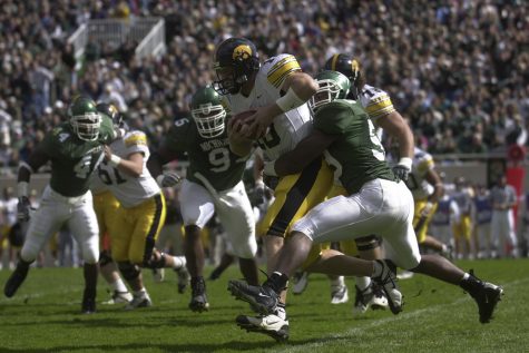 Nathan Chandler is sacked by MSU linebacker Mark Goebel during the second quarter of play.  Chandler had 9 carries for negative 24 yards. Nicholas Wynia/The Daily Iowan