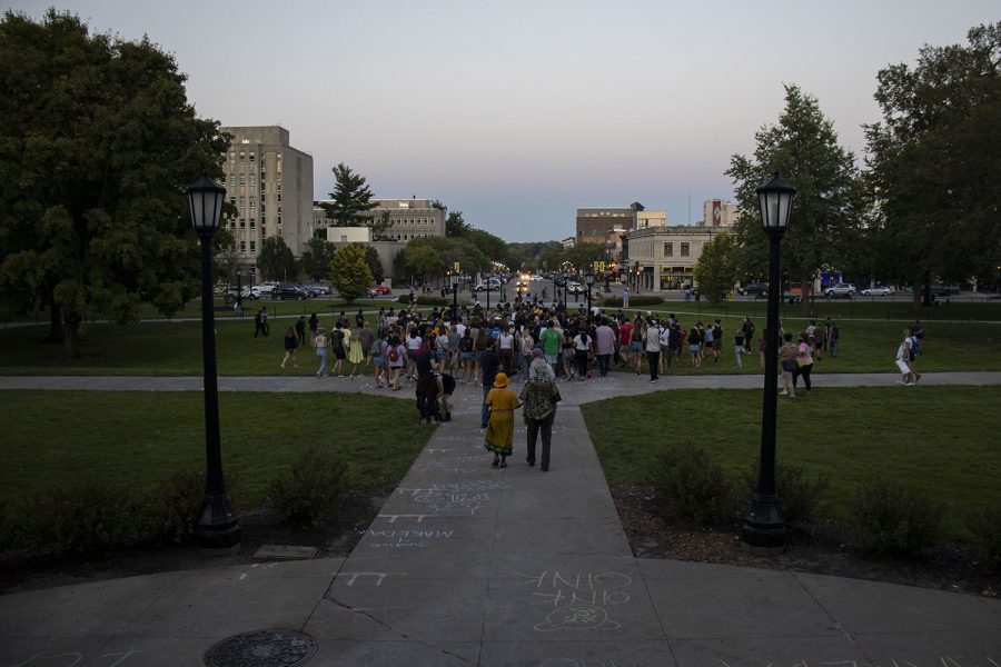 Protesters leave the Pentacrest toward Iowa Ave. on Friday, Aug. 21, 2020. Protesters marched to the Johnson County Sheriff’s Office and throughout downtown Iowa City demanding justice for the death of Makeda Scott and countless others, while encouraging observers to join the march against the inequality and discrimination that the Black community faces.