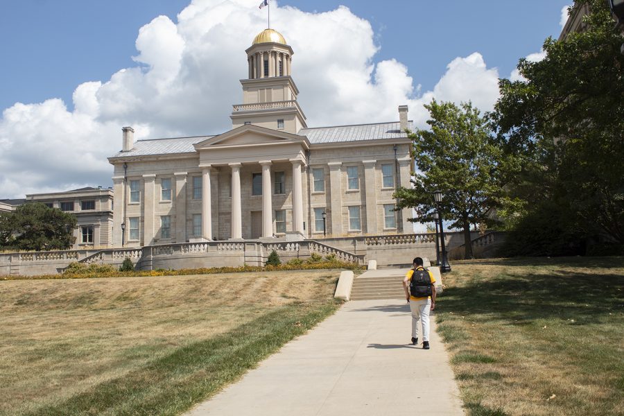 Pictured on Aug. 27, 2020, is a student walking through campus to their classes during the first week of school at the University of Iowa. Although school looks different this year, students are still on campus attending some in-person classes. (Grace Smith/The Daily Iowan)