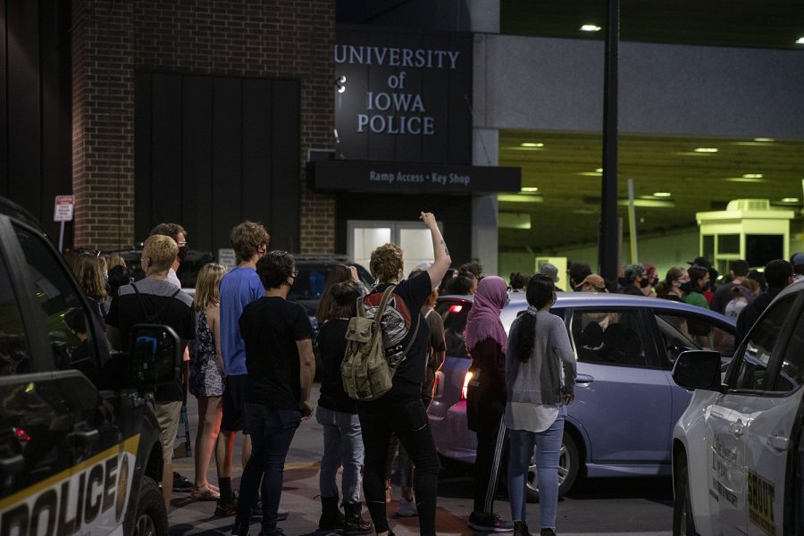 Protesters stop outside of the University of Iowa Police Department during a Black Lives Matter protest organized by the Iowa Freedom Riders on Sunday, Aug. 30, 2020. This was the third protest of a four day protest streak in which protesters took to the street to put pressure on the City Council. These protests lead up to a Tuesday meeting during which three of their demands will be discussed. 