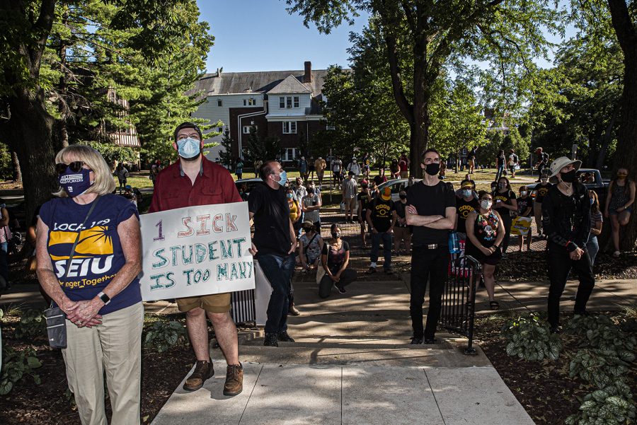 Protesters+stand+outside+of+University+of+Iowa+President+Bruce+Harrelds+home+as+part+of+a+demonstration+on+Wednesday%2C+Aug.+19%2C+2020.+The+Campaign+to+Organize+Graduate+Students+%28COGS%29+led+a+march+to+Harrelds+home+in+order+to+protest+the+administrations+insistence+that+the+university+remain+open+despite+the+health+risk+posed+by+COVID-19.