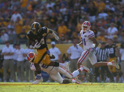 Iowa defensive back Desmond King avoids a tackle from Florida wide receiver Ahmad Fulwood during the Outback Bowl at Raymond James Stadium on Monday, Jan. 2, 2016. The Gators defeated the Hawkeyes, 30-3.