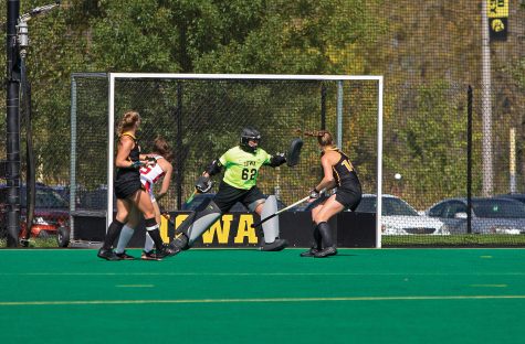 Iowa goalkeeper Grace McGuire blocks a shot on goal during the Iowa field hockey match against Rutgers on Friday, Oct. 4, 2019 at Grant Field. The Hawkeyes beat the Scarlet Knights 2-1. 