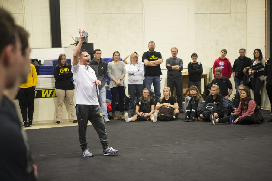 Iowa head coach JD Reive talks with attendees before the Black and Gold intrasquad in the Field House on Friday, Dec. 1, 2017. The Hawkeyes menÕs gymnastics team debuted their 2018 roster during the event.